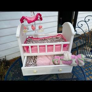 American Girl “Bitty Baby” bed set.